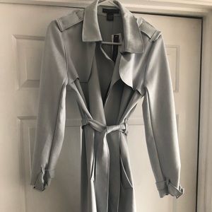 Joan Vas’s trench coat.
